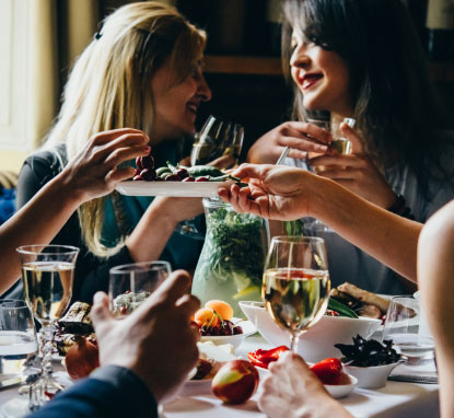 People enjoying dinner at a dinner table